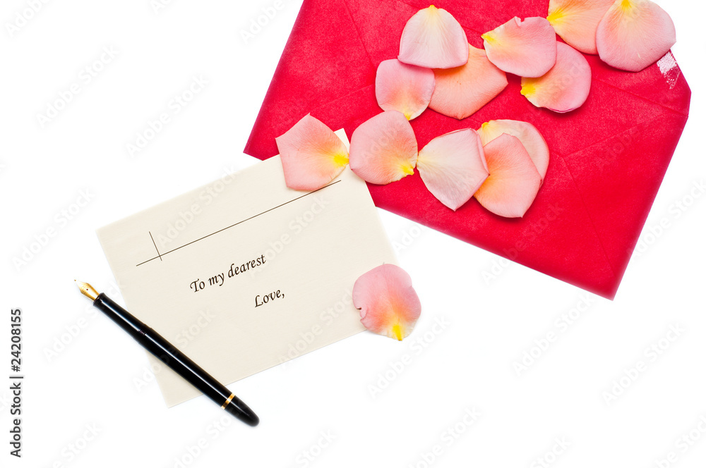 red gift note envelope with pen next to it and rose leaves red gift note envelope with pen next to it and rose leaves