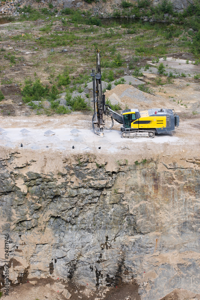 Drilling machine in open cast mining quarry Drilling machine in open cast mining quarry