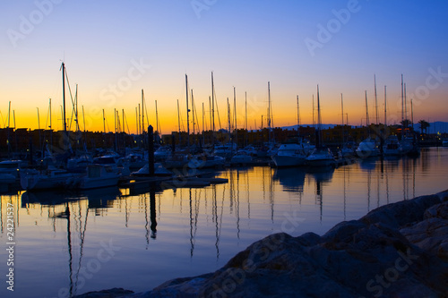 Marina with docked yachts at the end of the day