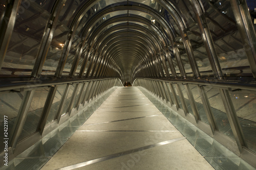 Bridge covered by roof made of chrome and glass