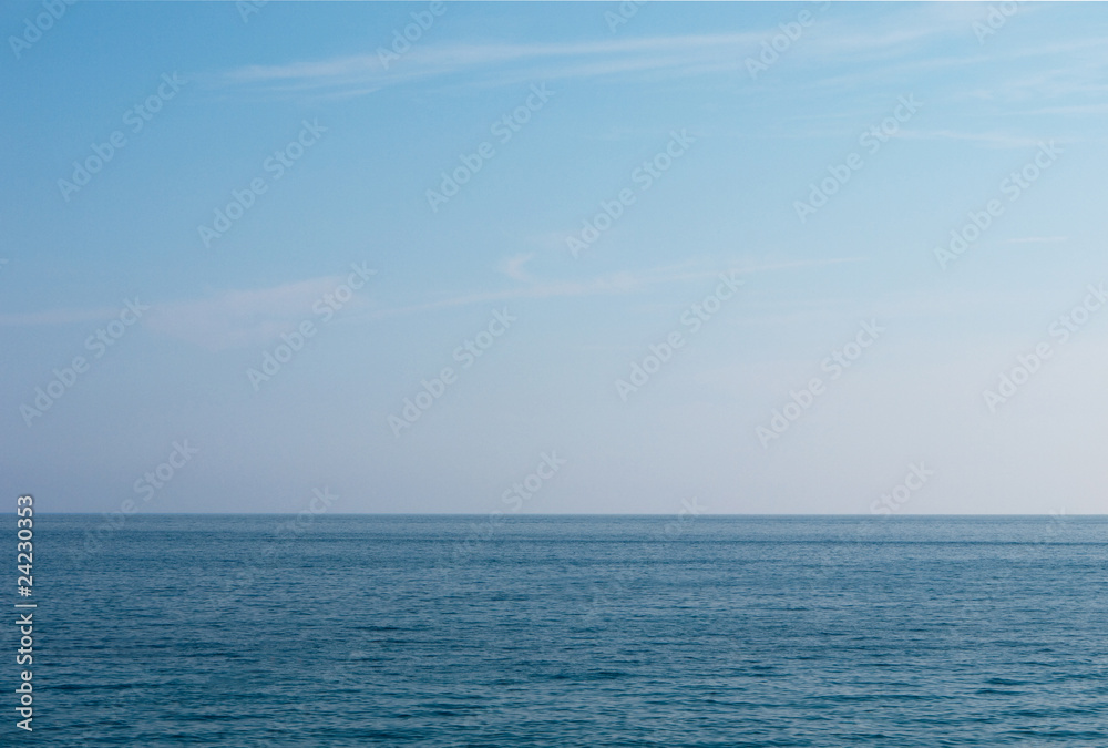 Calm sea, cloudless sky background
