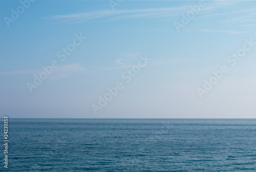 Calm sea, cloudless sky background