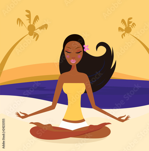 Woman doing yoga lotus position at the beach sunset