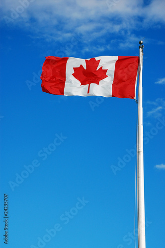 Canadian flag waving in breeze