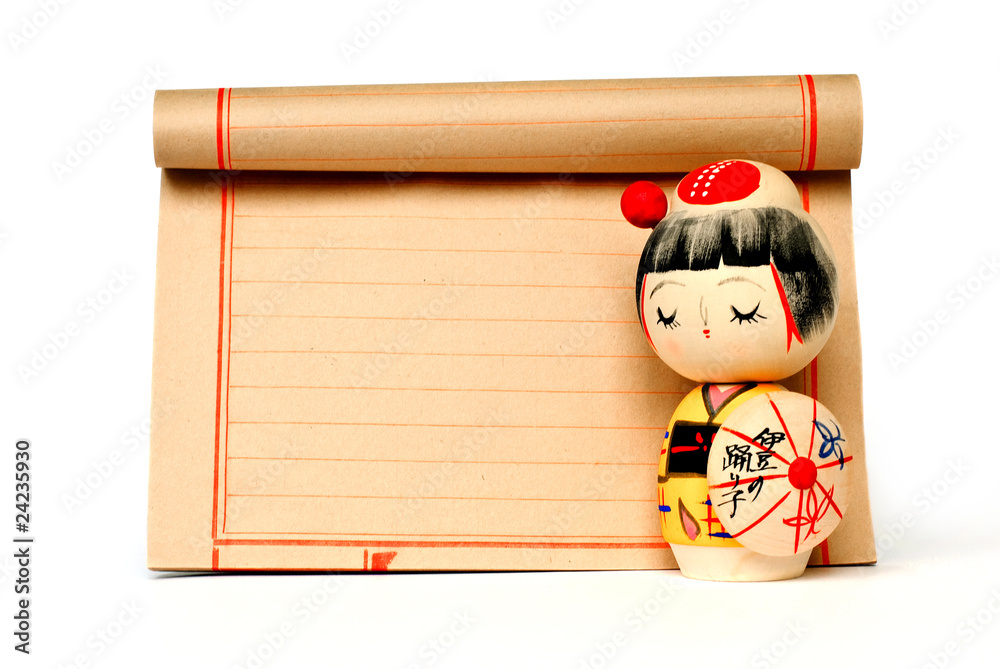 Fototapeta premium japanese traditional doll and paper with copy space isolated