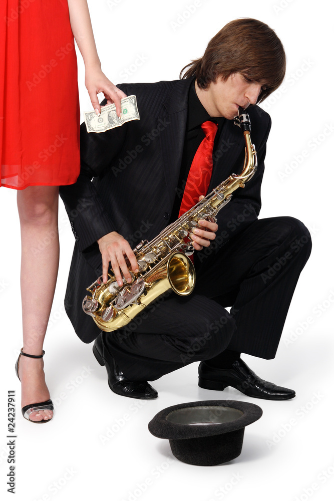 Naklejka premium Girl alms to a man who plays the sax
