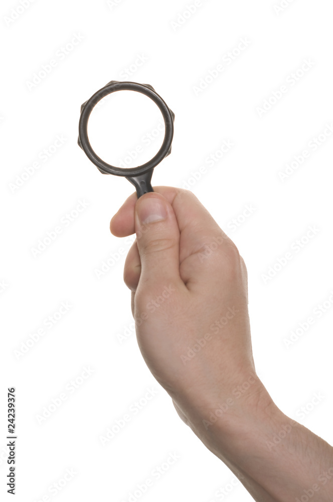 well shaped hand with a magnifying glass isolated over white well shaped hand with a magnifying glass isolated over white