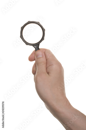 well shaped hand with a magnifying glass isolated over white
