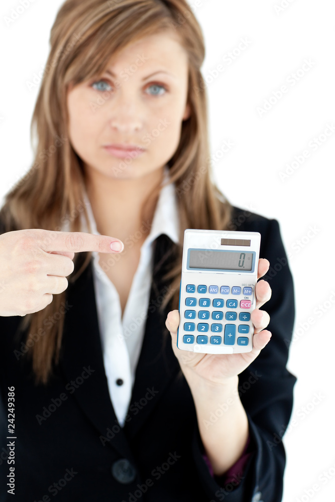 Depressed businesswoman holidng a calculator Depressed businesswoman holidng a calculator