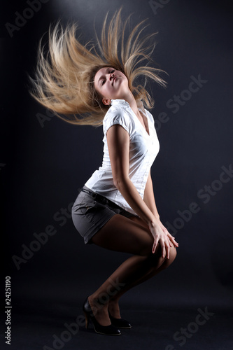 woman modern dancer against black background