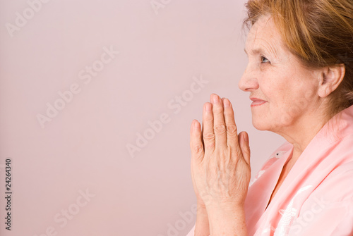 elderly woman praying