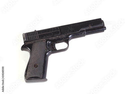Old hand gun on a plain white background. © J and S Photography
