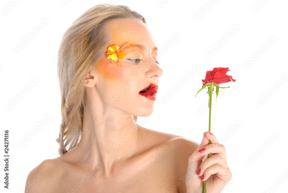 Young woman bites red flower