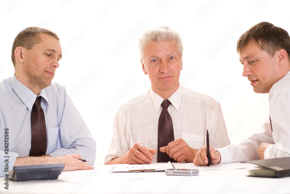 businessmen working at a table businessmen working at a table