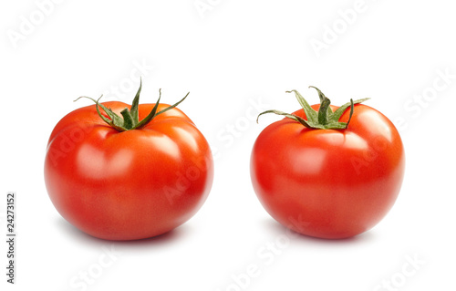 Two tomatoes isolated on white background