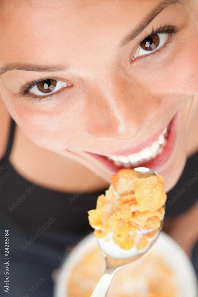 Woman eating cornflakes Woman eating cornflakes