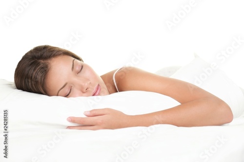 Woman sleeping on white background photo