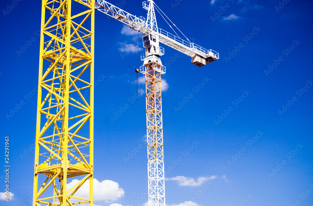 Yellow crane detail over blue sky Yellow crane detail over blue sky