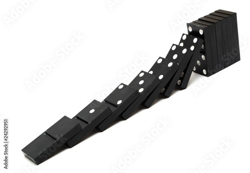 Stack of dominoes falling. Isolated on a white background