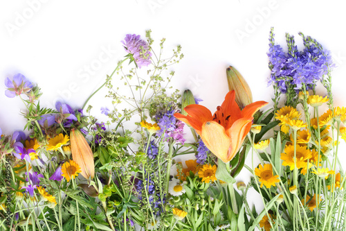 Wild flowers on a white table photo