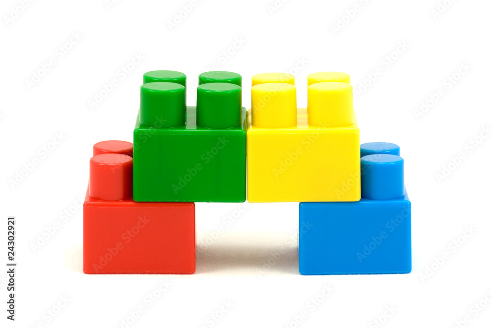 four colorful plastic toy bricks ,over a white background four colorful plastic toy bricks ,over a white background