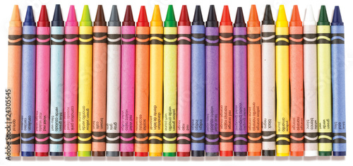 colorful row of crayons on a white background photo