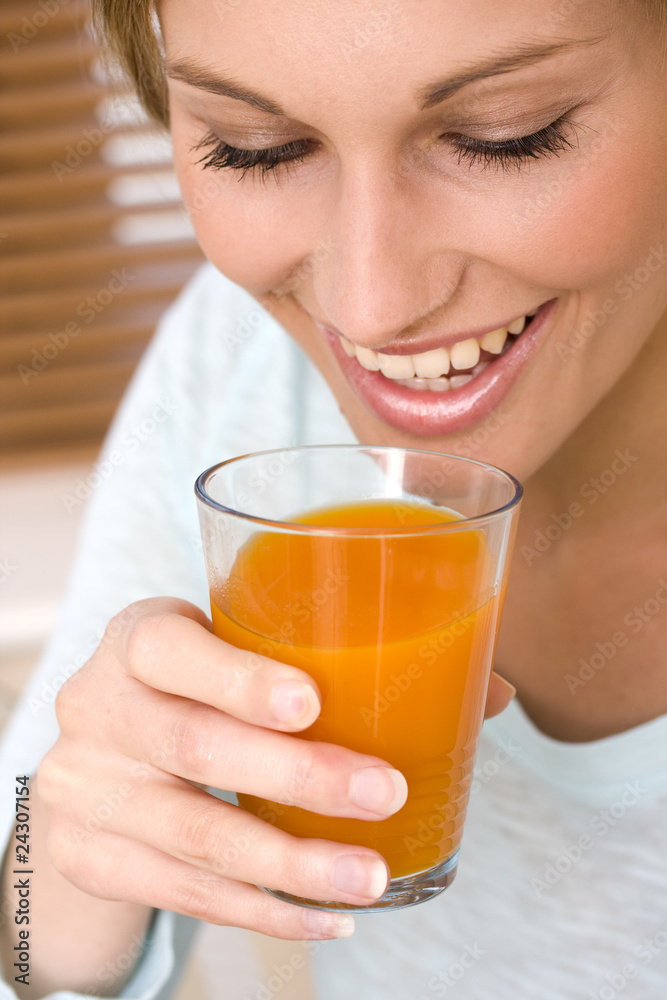 Beautiful young woman drinking orange juice Beautiful young woman drinking orange juice