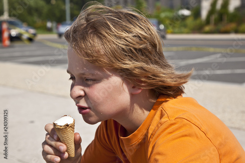 boy enjoys ice cream photo