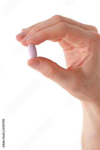 Male hand with pill over white background