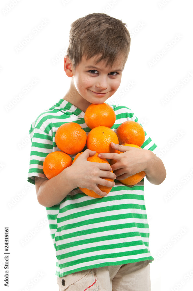 Boy holding oranges