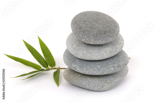 Stacked zen stones with bamboo leaf