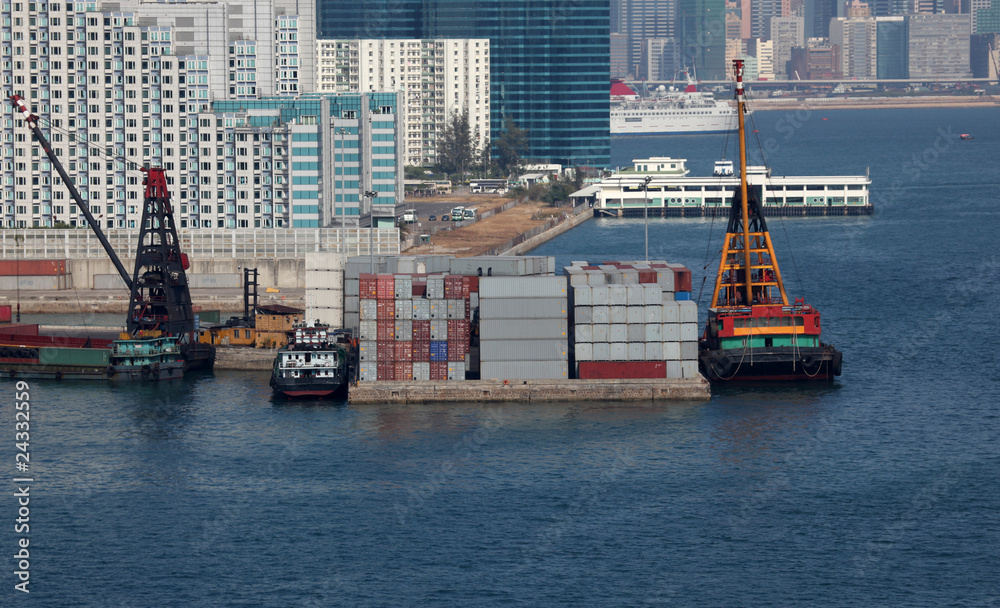 Barges being loaded at a container terminal in Hong Kong
