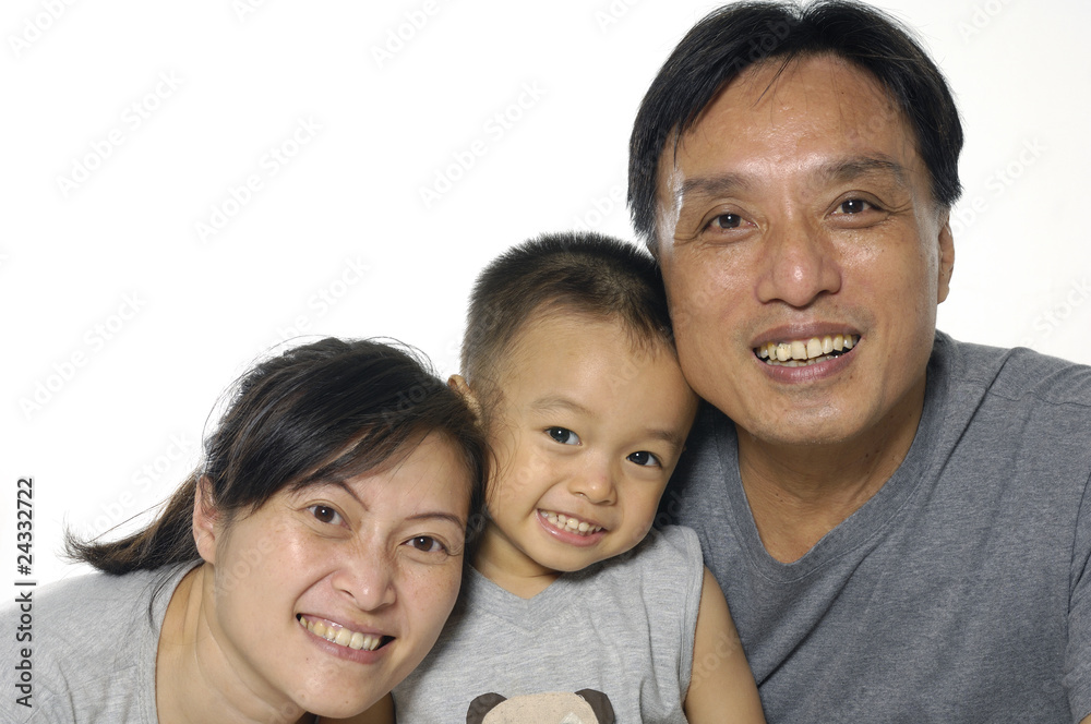 Asian mother, father and little boy. Isolated on white Asian mother, father and little boy. Isolated on white