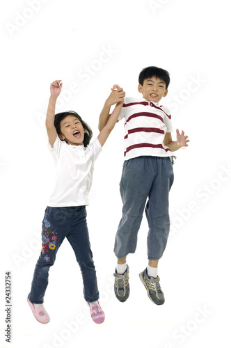Boy and girl jumping
