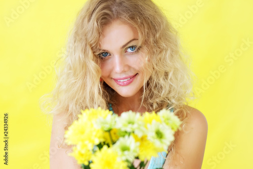 Beautiful girl holding chrysanthemums