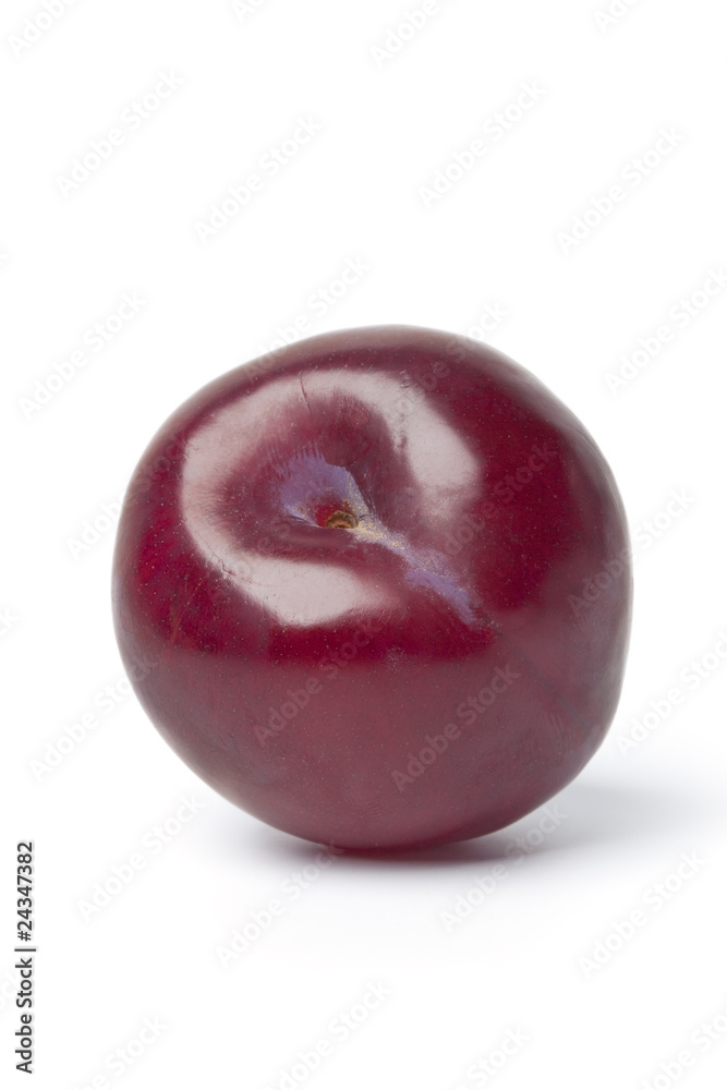 Whole single fresh purple plum