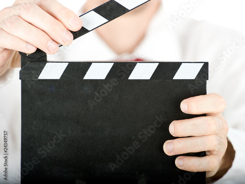 businessman with a clapperboard isolated on white background