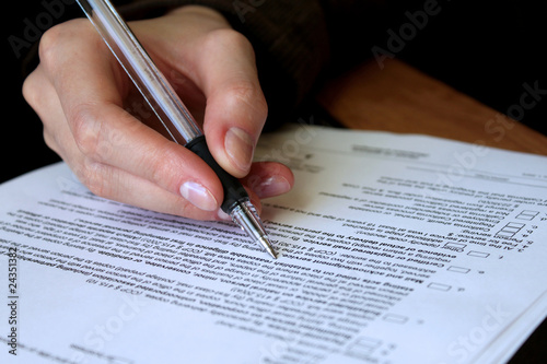 review and filling out legal contract photo