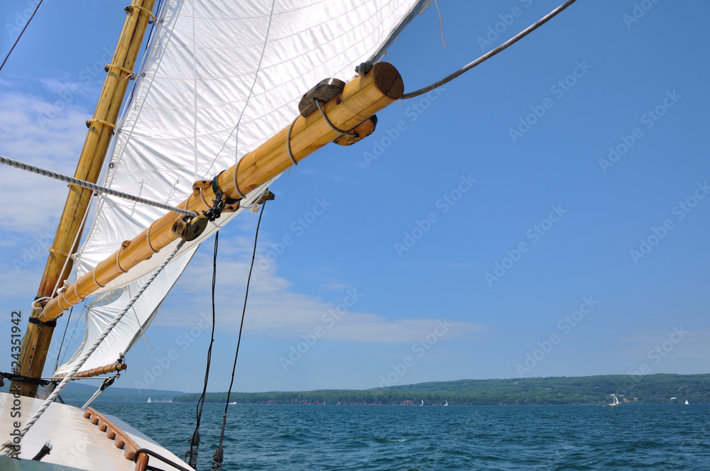Foresail and Wooden Mast of Schooner Sailboat Foresail and Wooden Mast of Schooner Sailboat