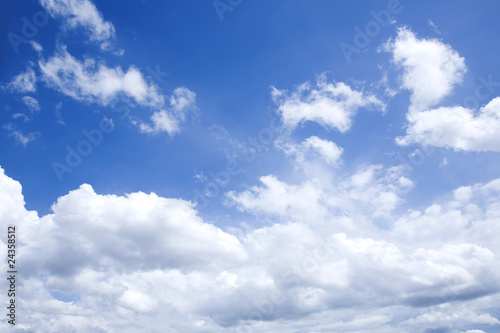 bright blue sky with white clouds on sunny day