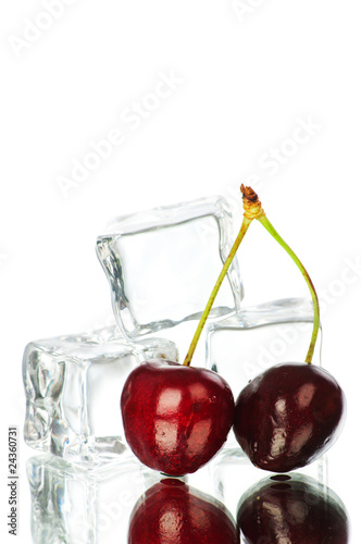 Cherry and ice cubes isolated on white background