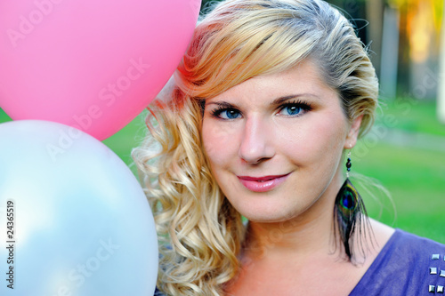 Beautiful young woman with fashion haitstyle with baloons outdoo © Dmitrijs Gerciks