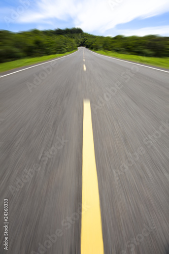 high speed pass through the empty road © Tom Wang