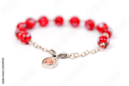 Red bracelet with medalion containing the picture of Mary Magdal