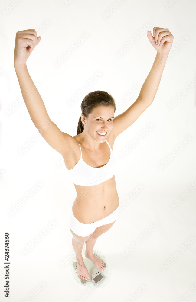 woman wearing underwear standing on weight scale woman wearing underwear standing on weight scale