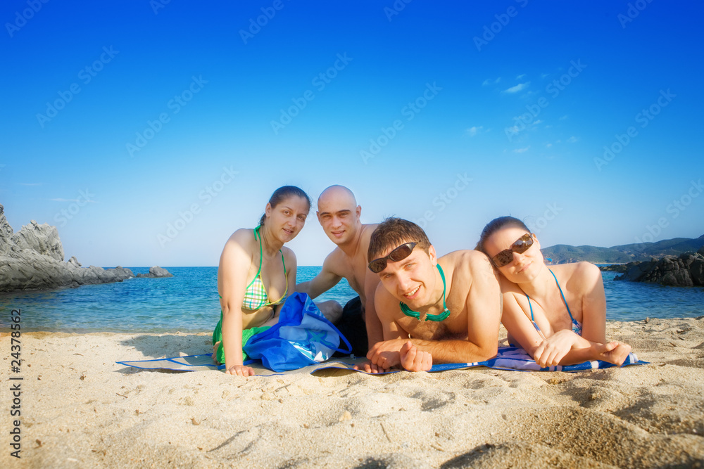 Happy friends on beach