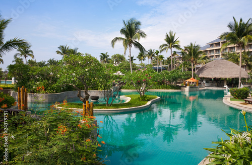 Tropical resort swimming pool © ping han