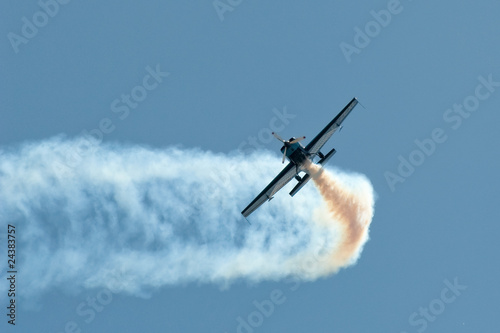 stunt pilot making a sharp aerobatic turn