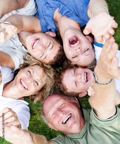 Multi-generation family lying in circle