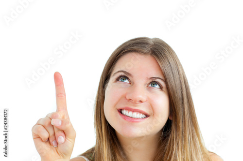Jolly young woman pointing upward isolated